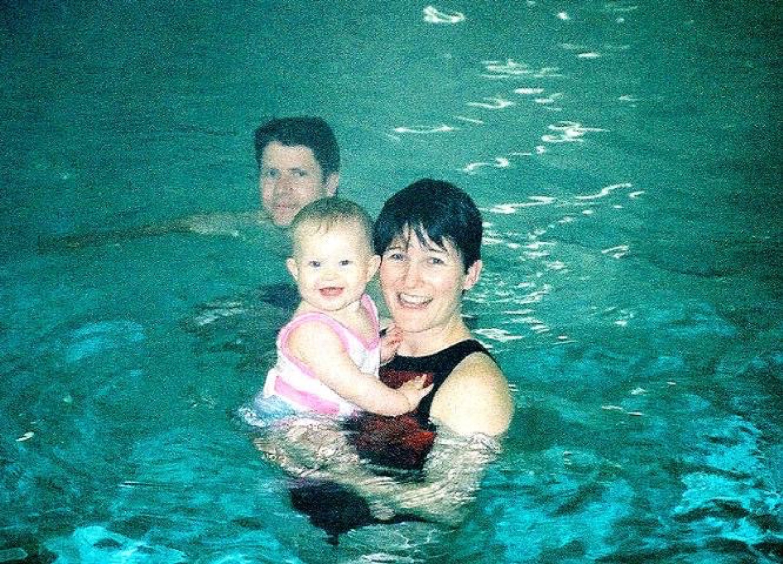 Emily as a baby with her parents