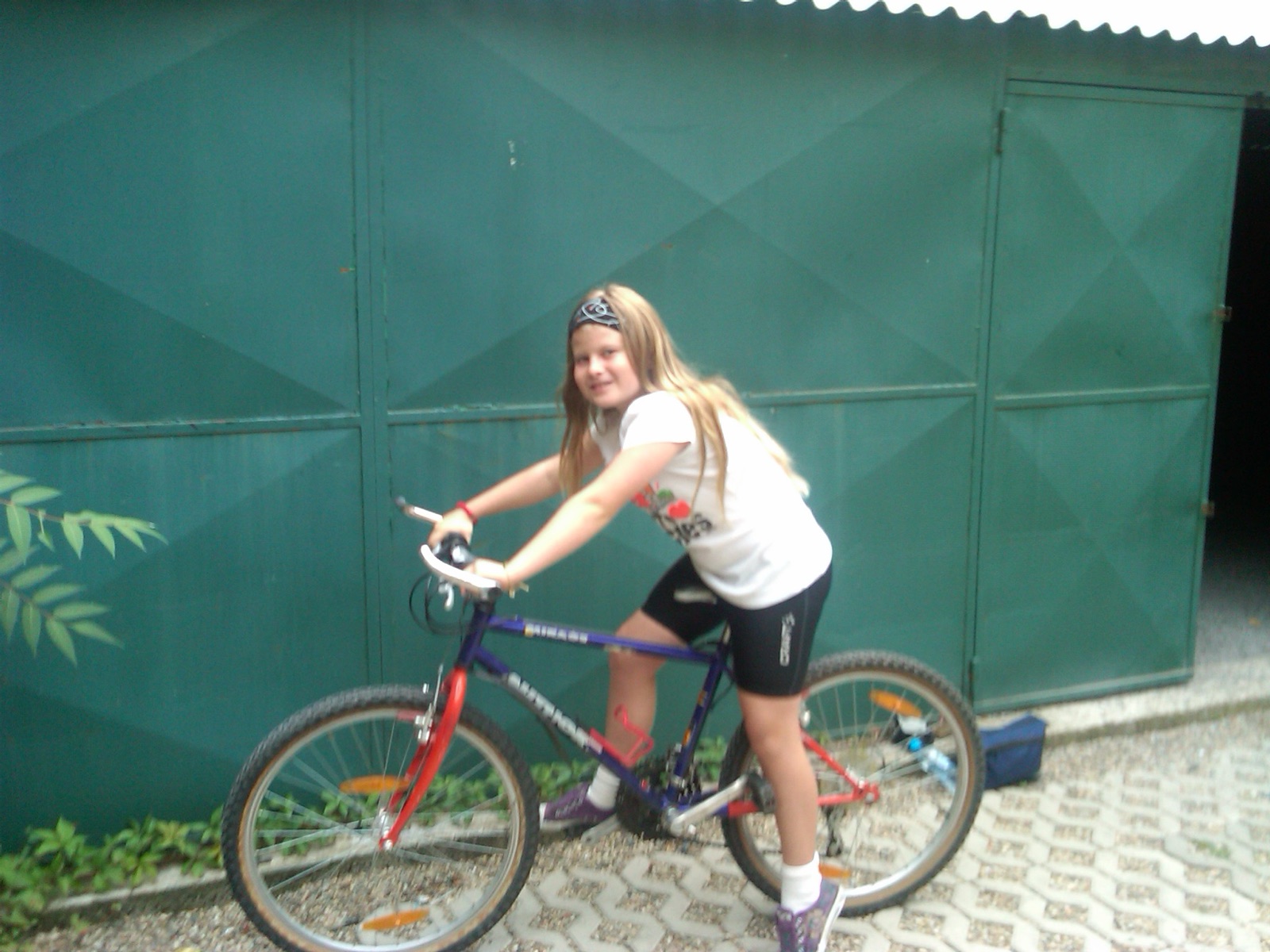 Emily as a child on a bike