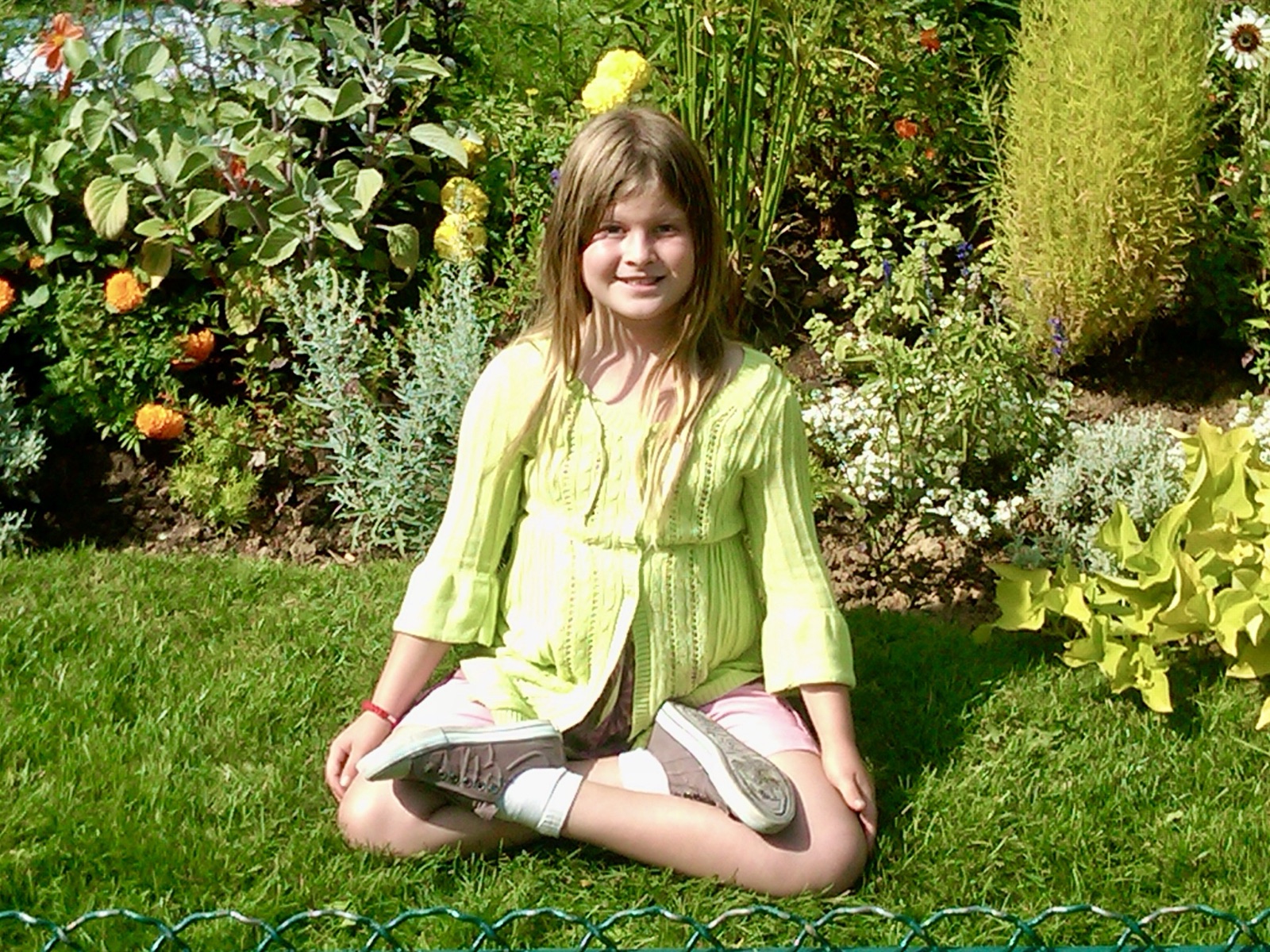 Emily as a child in a yoga pose