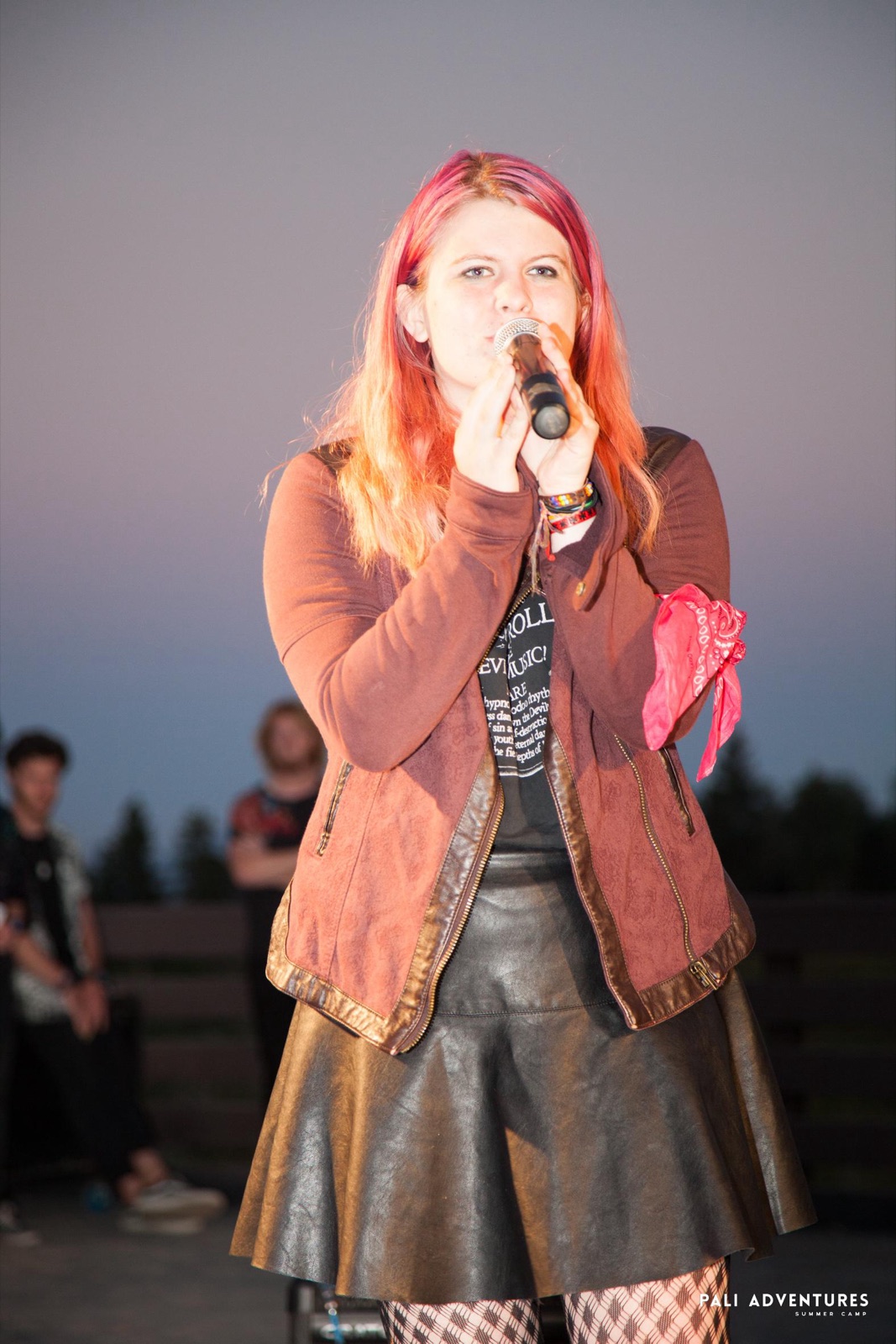 Emily singing on stage